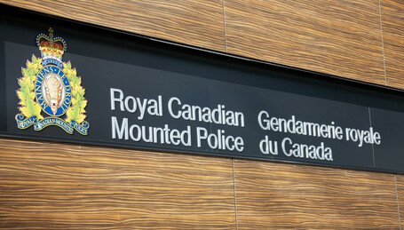 sign reading Royal Canadian Mounted Police in english and french 